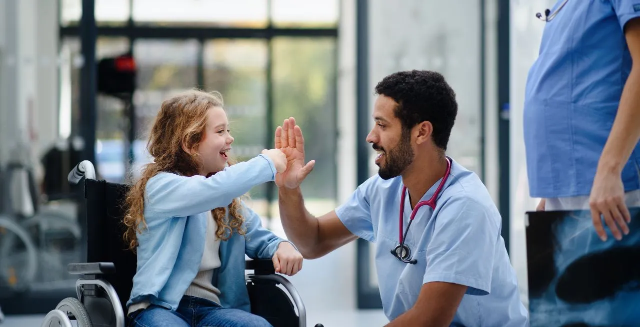 picture of a pediatric nurse giving a high five